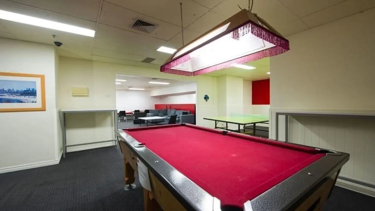 Pool table ping pong table lounge area common room at Student Living-339 Swanston in Melbourne Student Accommodation