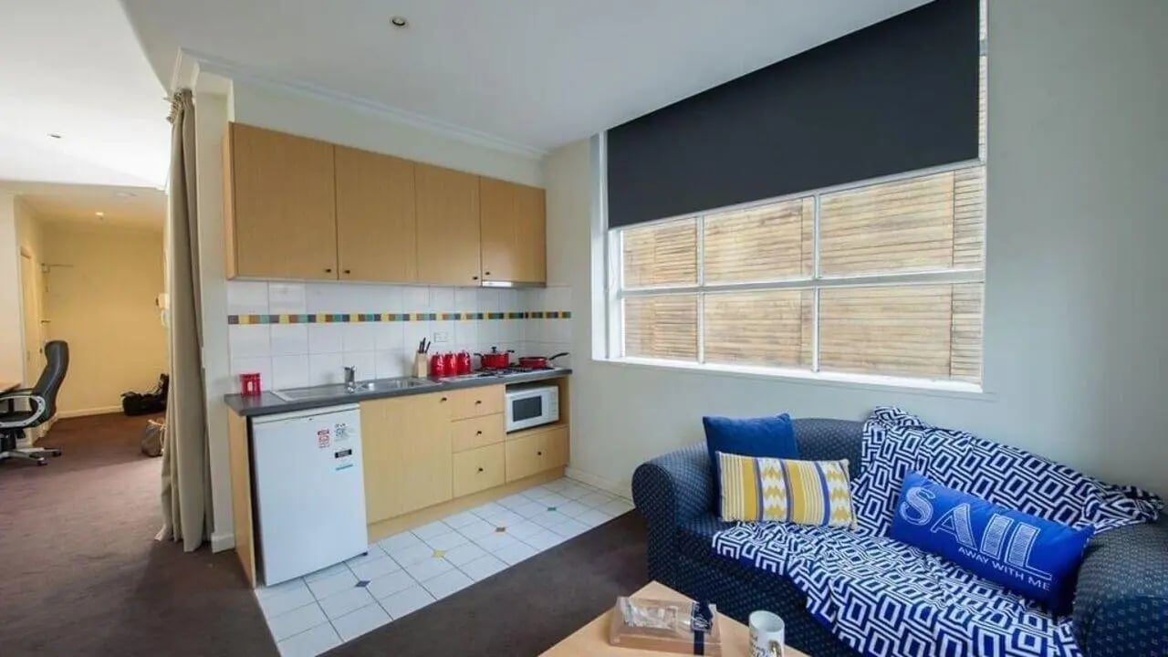 Kitchenette with couch and window living room at Student Living-339 Swanston in Melbourne Student Accommodation
