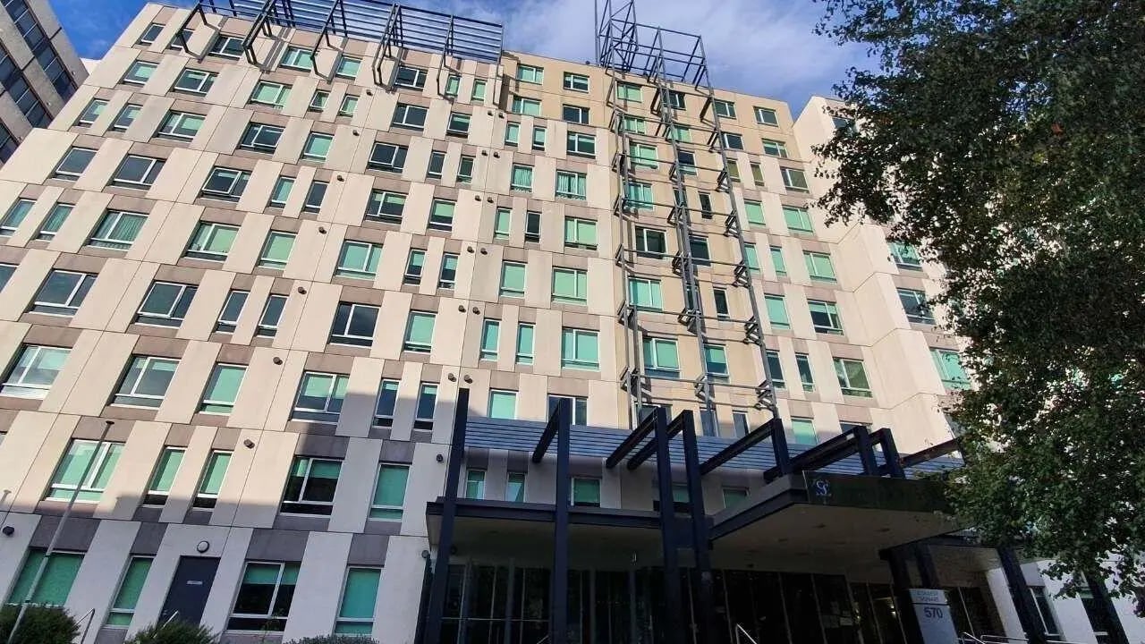 Modern student accommodation building with many windows exterior at Student Living - 570 Lygon in Melbourne Student Accommodation