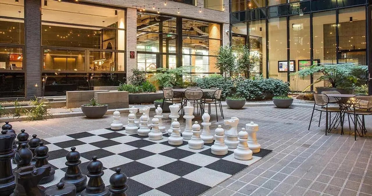 Giant chess set with outdoor seating area exterior at Iglu Melbourne City in Melbourne Student Accommodation