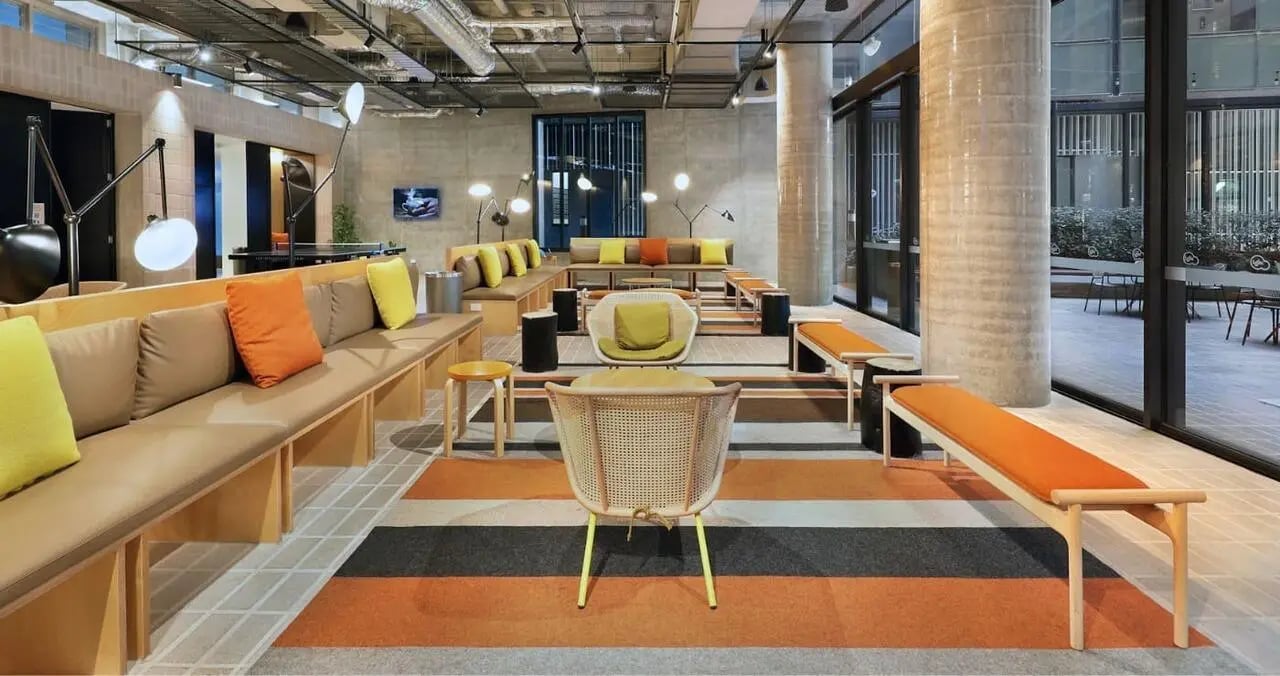 Modern lounge with seating and colourful cushions. at Iglu Melbourne City in Melbourne Student Accommodation