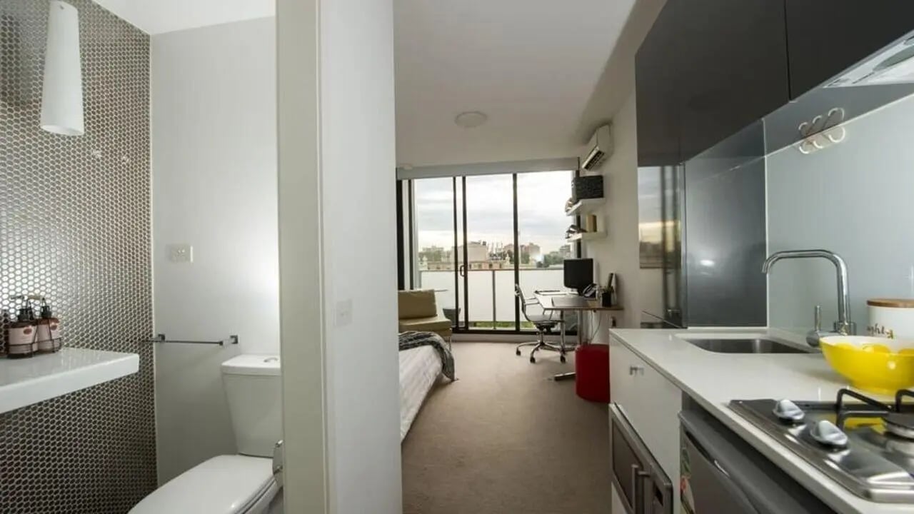 Studio apartment bed desk kitchen bathroom at Student Living D2 in Melbourne Student Accommodation