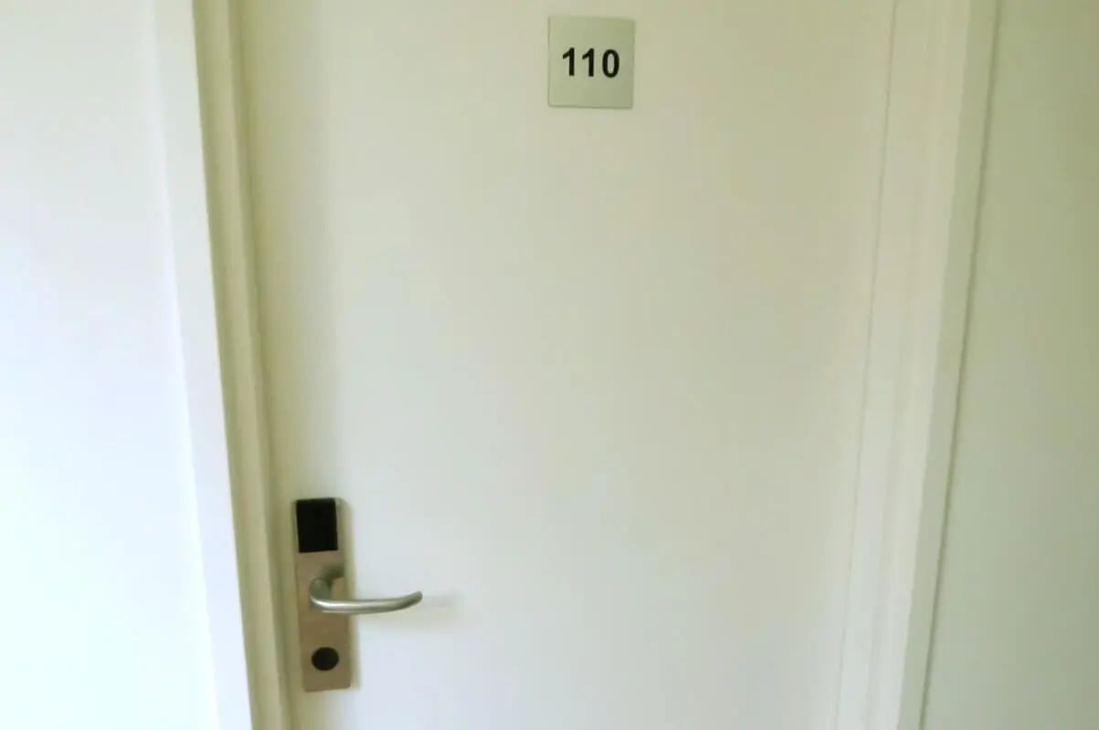 Door number 110 with silver handle Door image at Link2 Broadway in Sydney Student Accommodation