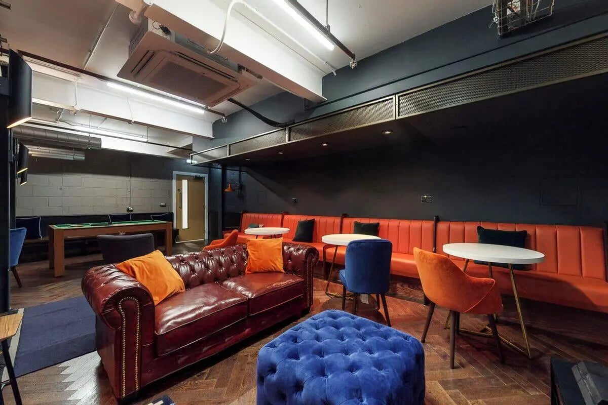 Chesterfield sofa pool table seating area living room at Haymarket Edinburgh in Edinburgh Student Accommodation