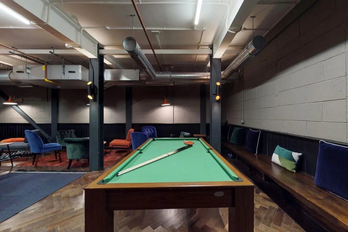 Pool table with cues and chairs playing area at Haymarket Edinburgh in Edinburgh Student Accommodation