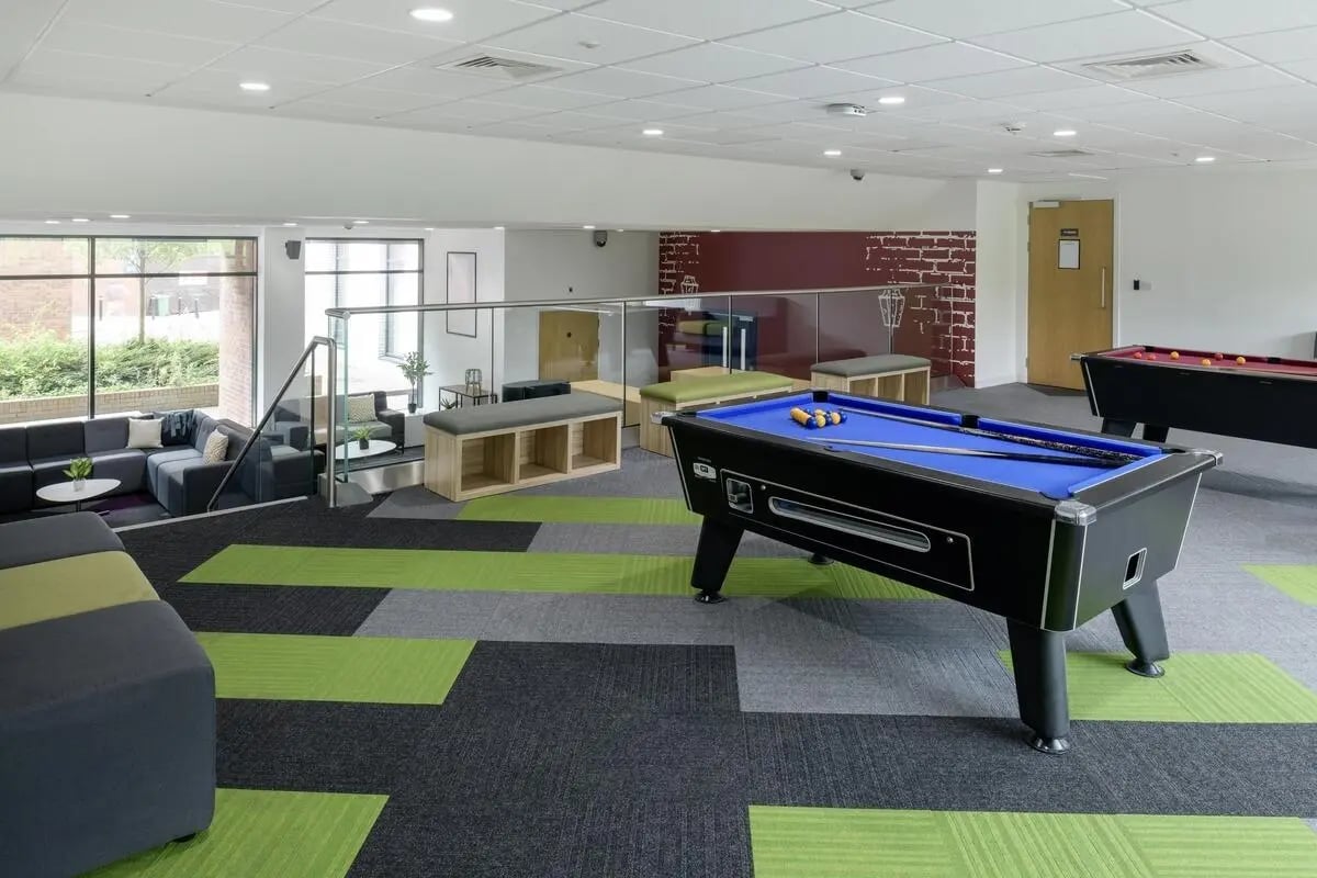 Pool tables with seating and lounge area common area at St James Glasgow in Glasgow Student Accommodation