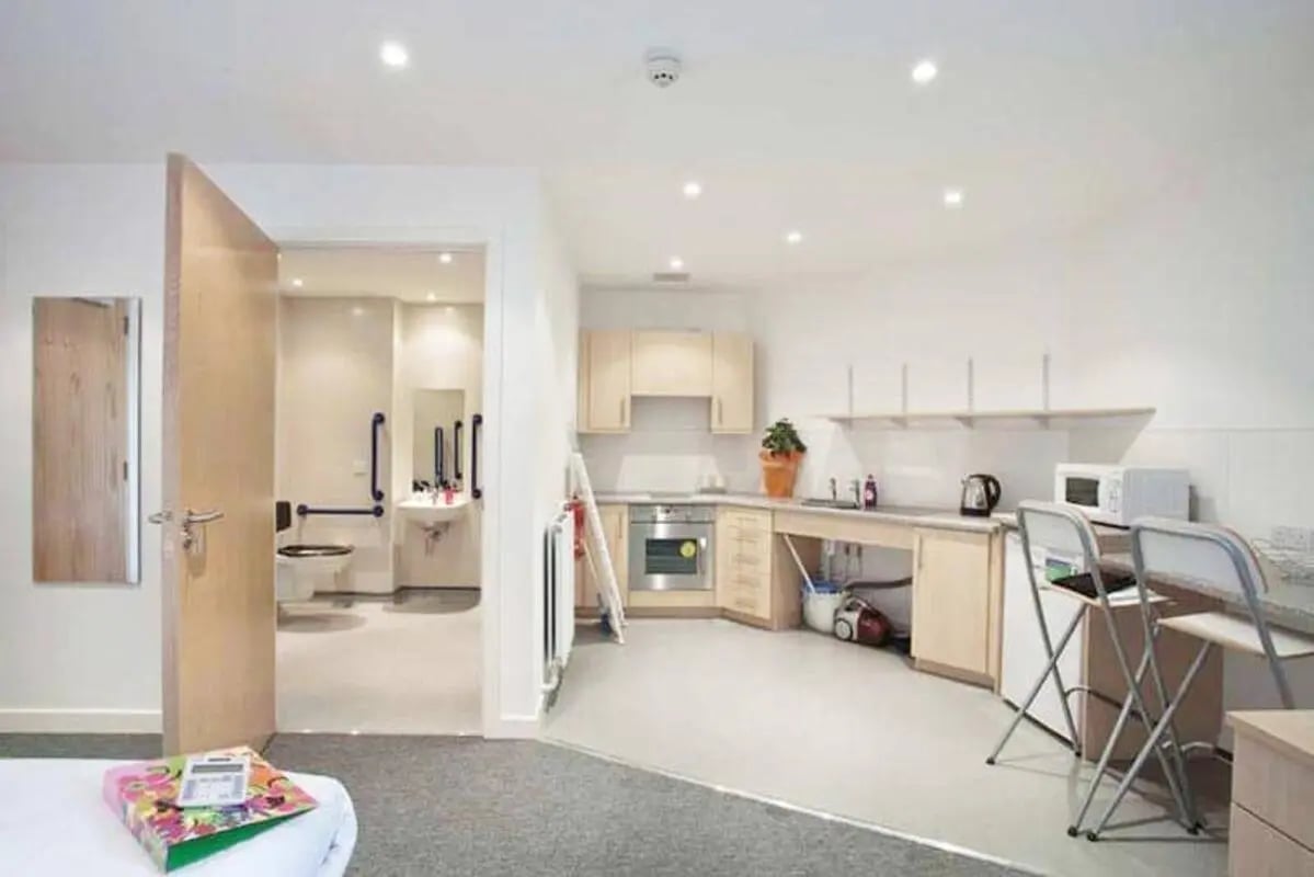 Kitchen area with oven microwave and chairs kitchen at Edinburgh College Residences in Edinburgh Student Accommodation