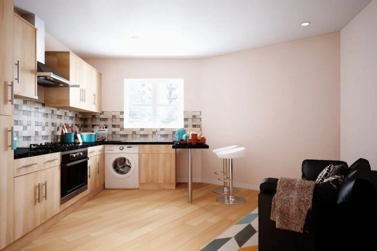 Kitchen with washing machine, sofa, bar stools kitchen at City Edge - Manchester in Manchester Student Accommodation