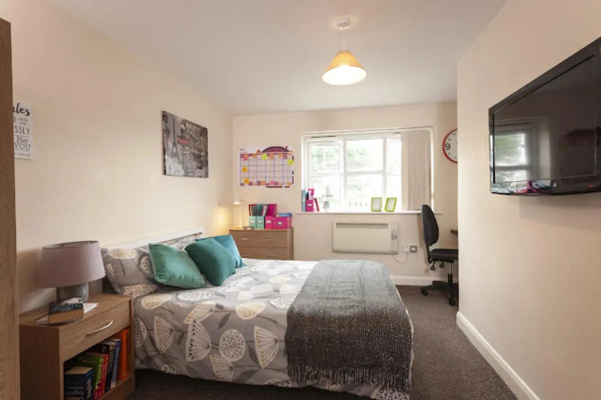 Bed desk lamp dresser and bed bedroom at City Edge - Manchester in Manchester Student Accommodation