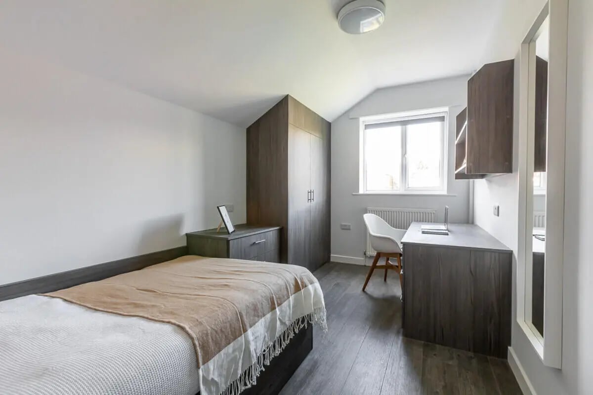 Bed desk wardrobe and chair bedroom at Hyde Park in Leeds Student Accommodation