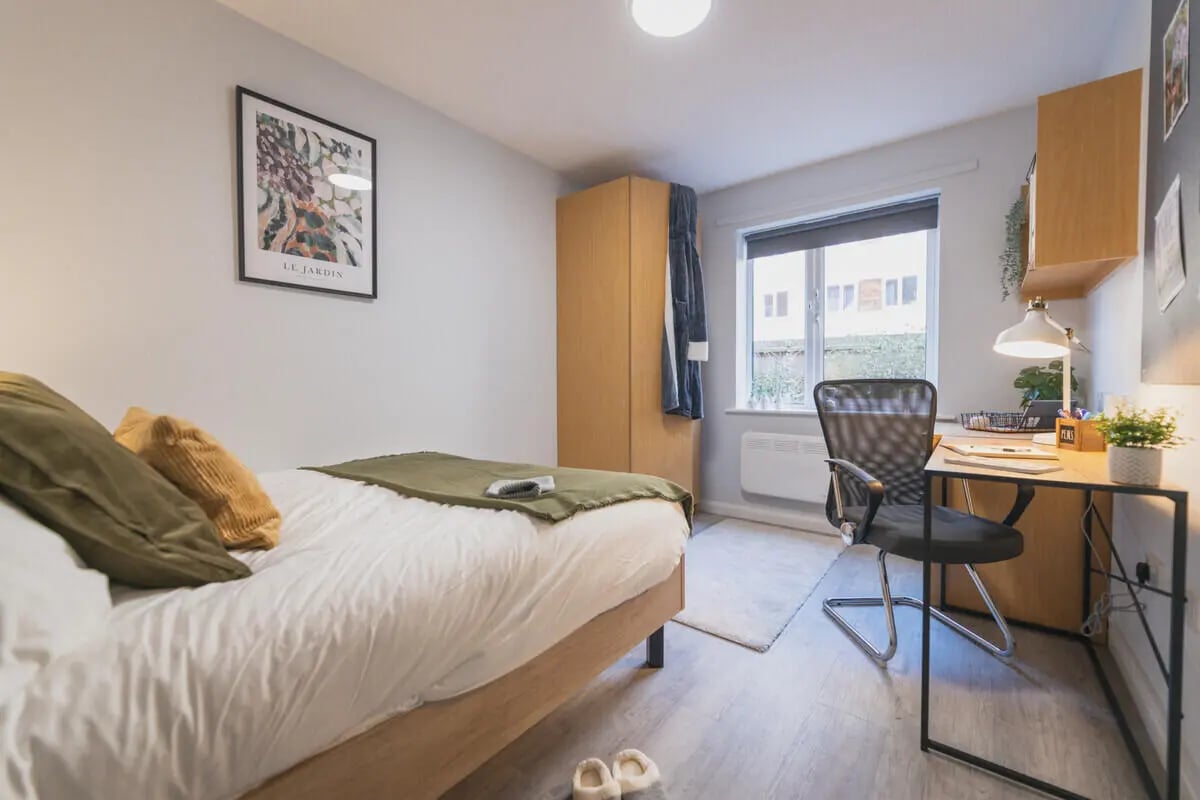 Bed desk closet and window bedroom at Madison Gardens in Nottingham Student Accommodation