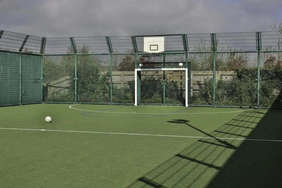 Football court with goal and basketball hoop outdoor court at Madison Gardens in Nottingham Student Accommodation