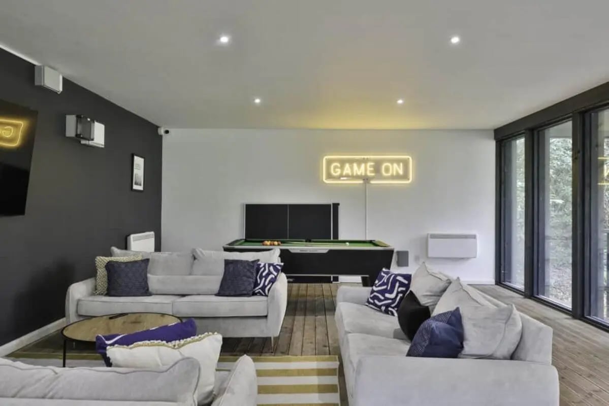 Sofas pool table neon sign lounge at Beech Gardens in Birmingham Student Accommodation