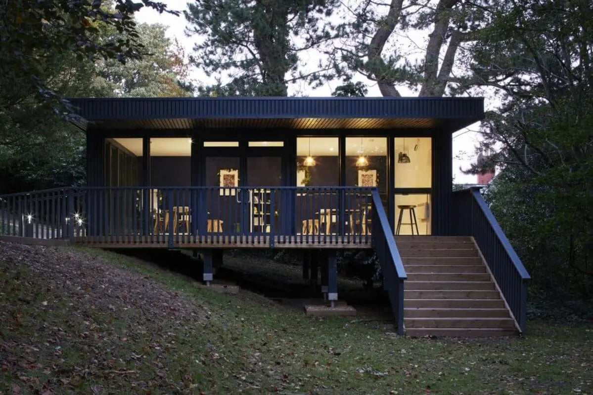 Modern cabin with deck tables and chairs exterior at Beech Gardens in Birmingham Student Accommodation