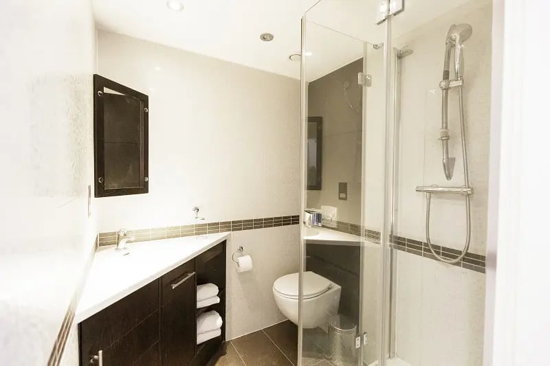Modern student bathroom sink toilet and shower at AXO Oxford Circus in London Student Accommodation
