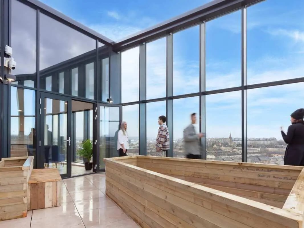 Wooden planters large windows city view outdoor area at True Glasgow in Glasgow Student Accommodation