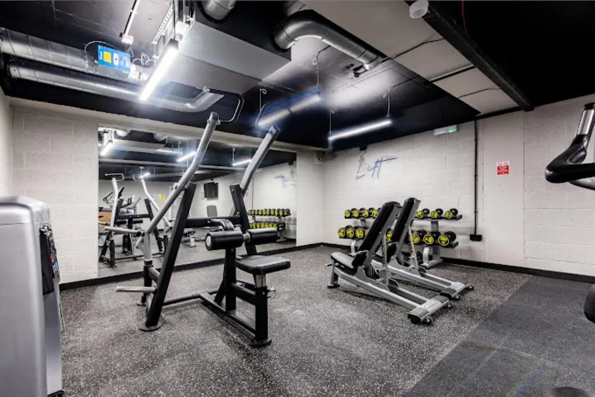 Weight machines and dumbbells in gym at Broadgate House Student Living in Nottingham Student Accommodation