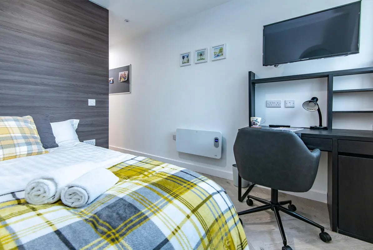 Bed desk chair TV heating study area bedroom at Broadgate House Student Living in Nottingham Student Accommodation