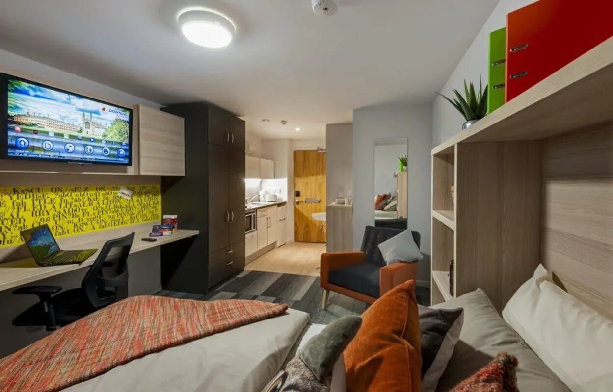 Bed desk laptop TV kitchen sink sofa armchair Bedroom at The Railyard Cambridge in Cambridge Student Accommodation