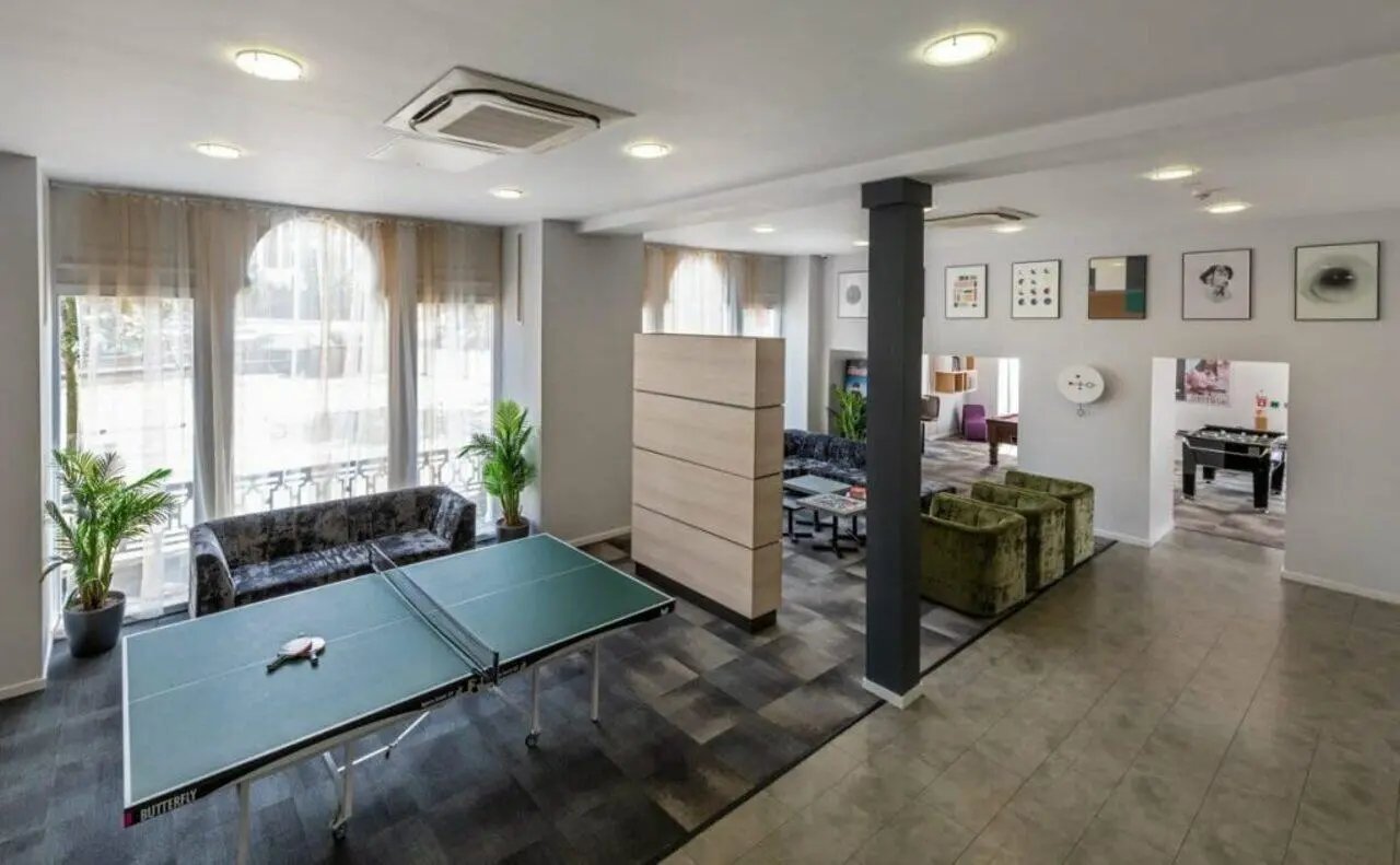 Ping pong table and sofas communal area living room at The Arch - Liverpool in Liverpool Student Accommodation
