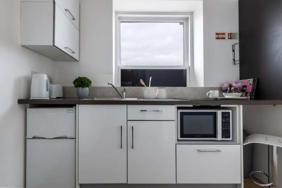 Compact kitchen with fridge microwave and sink kitchen at The Arch - Liverpool in Liverpool Student Accommodation