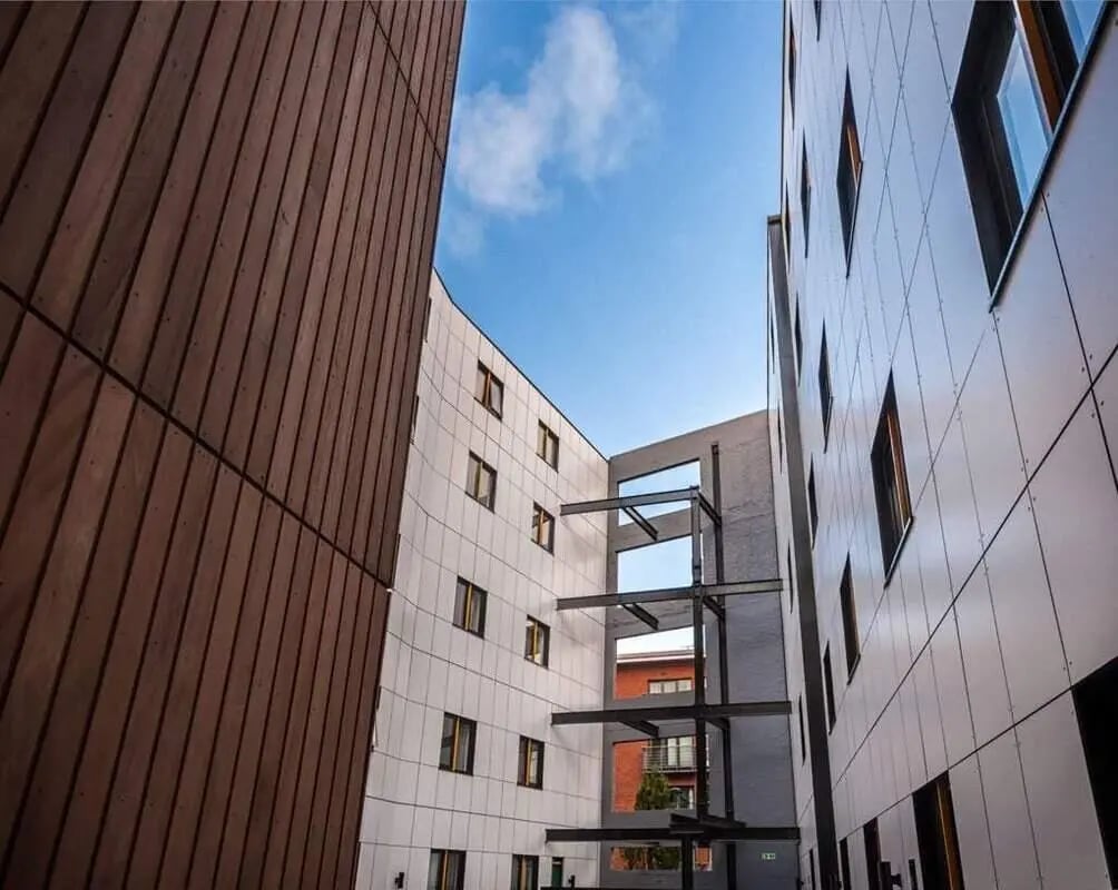 Modern building facade with wood and white panels exterior at The Arch - Liverpool in Liverpool Student Accommodation
