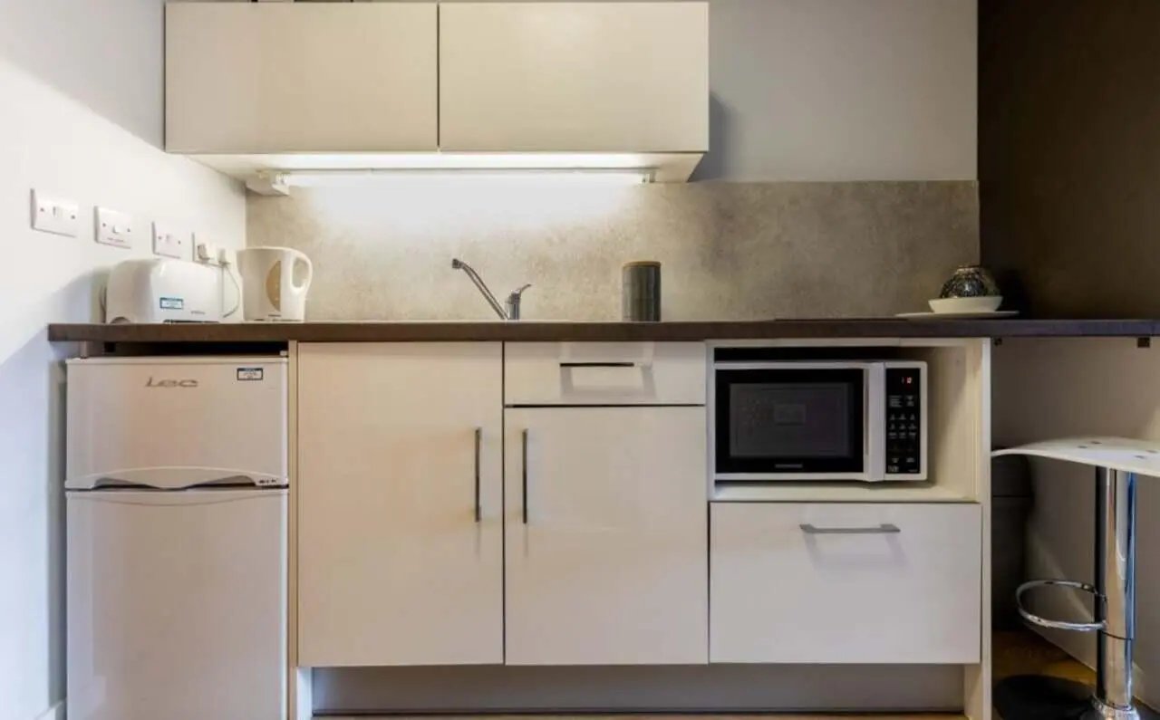 Compact kitchen with fridge microwave and kettle kitchen at The Electra in Liverpool Student Accommodation