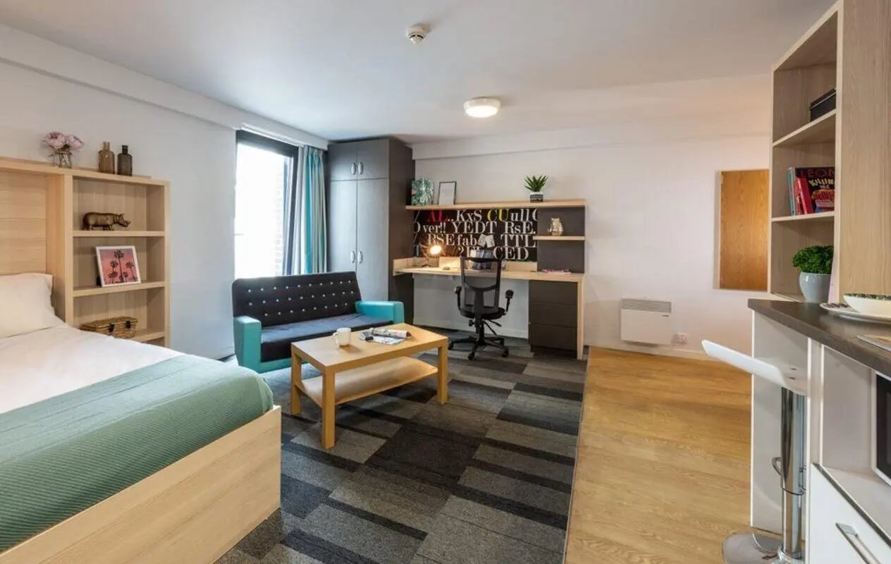 Bed sofa desk and kitchen area studio at The Electra in Liverpool Student Accommodation
