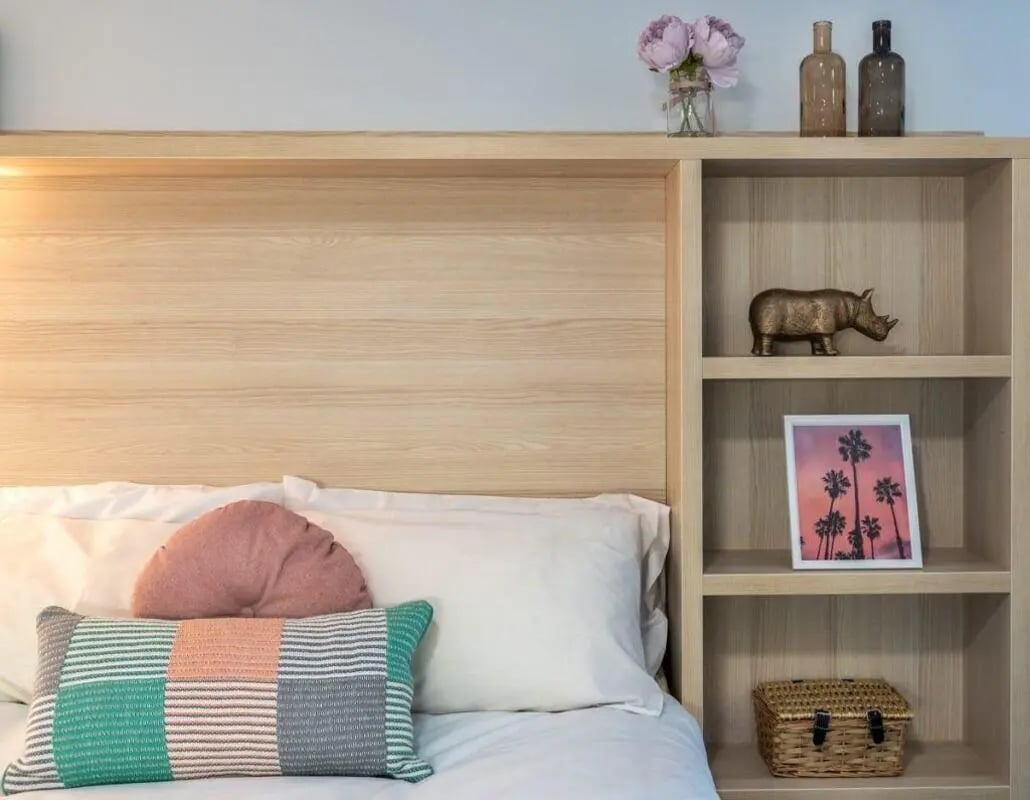 Bed with pillows and bookshelf decor bedroom at The Electra in Liverpool Student Accommodation