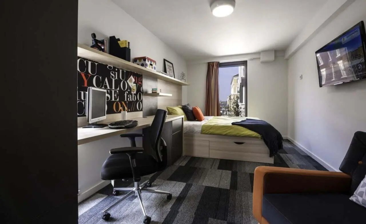 Desk chair bed computer and shelves bedroom at The Electra in Liverpool Student Accommodation