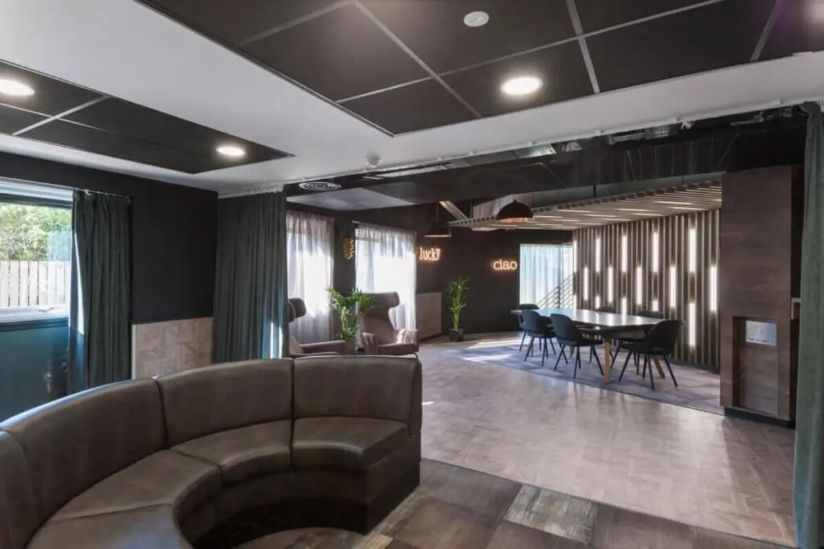 Curved sofa and dining table lounge at New Park in Edinburgh Student Accommodation
