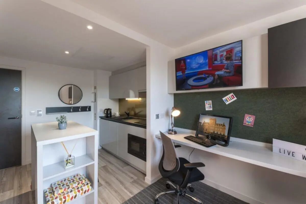 Desk kitchen area with TV and desk Study area at New Park in Edinburgh Student Accommodation