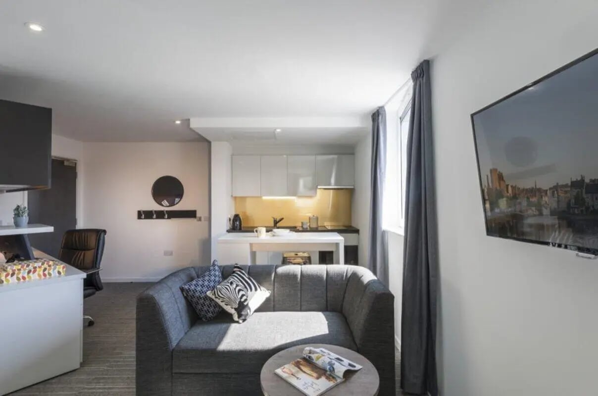 Sofa kitchen and TV area living room at New Park in Edinburgh Student Accommodation