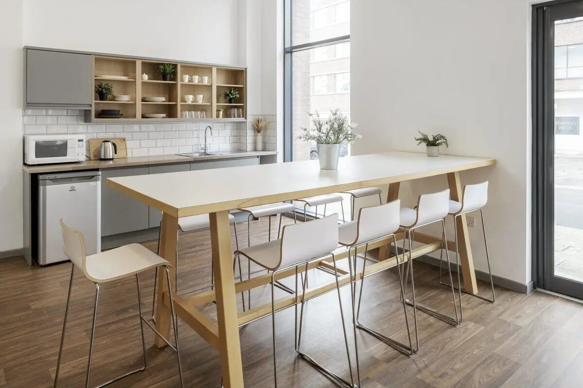 Kitchen island with bar stools and appliances kitchen at Turner Court in Newcastle Upon Tyne Student Accommodation