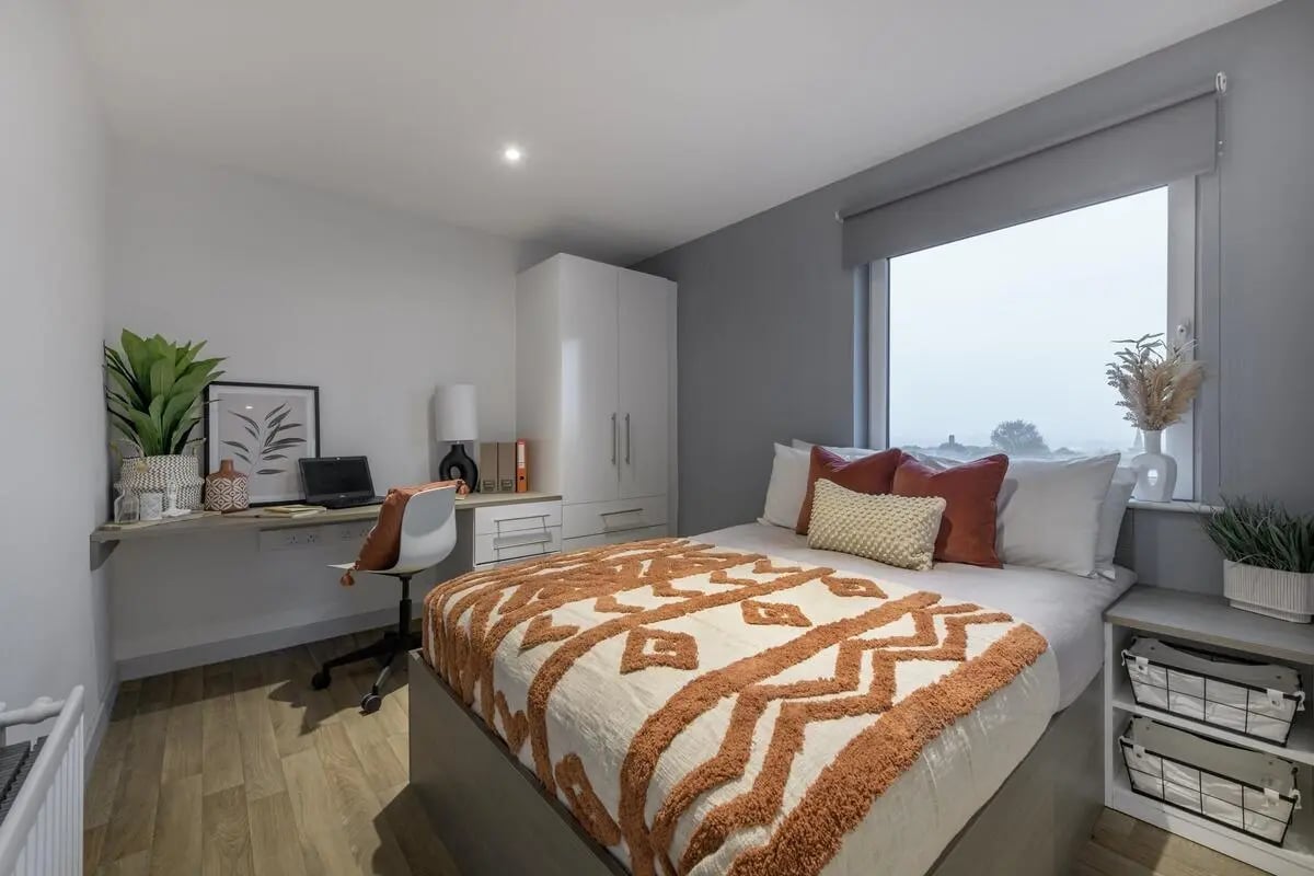 Bed desk wardrobe and window bedroom at The Bridge in Newcastle Upon Tyne Student Accommodation