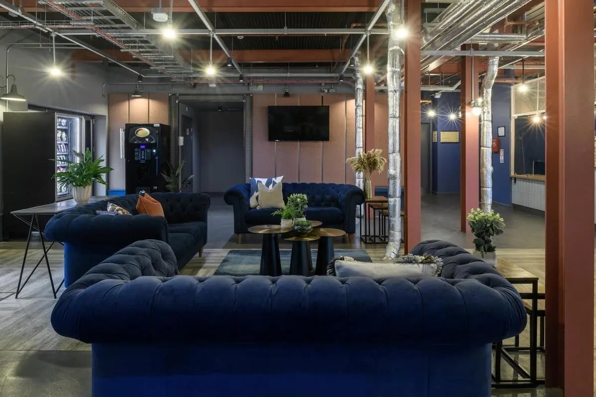 Blue sofas and vending machines communal area at The Bridge in Newcastle Upon Tyne Student Accommodation
