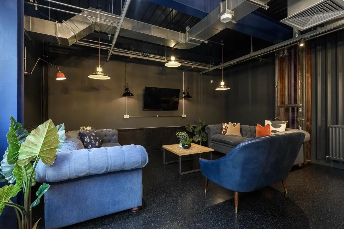 Sofas coffee table television plant lounge area at The Bridge in Newcastle Upon Tyne Student Accommodation
