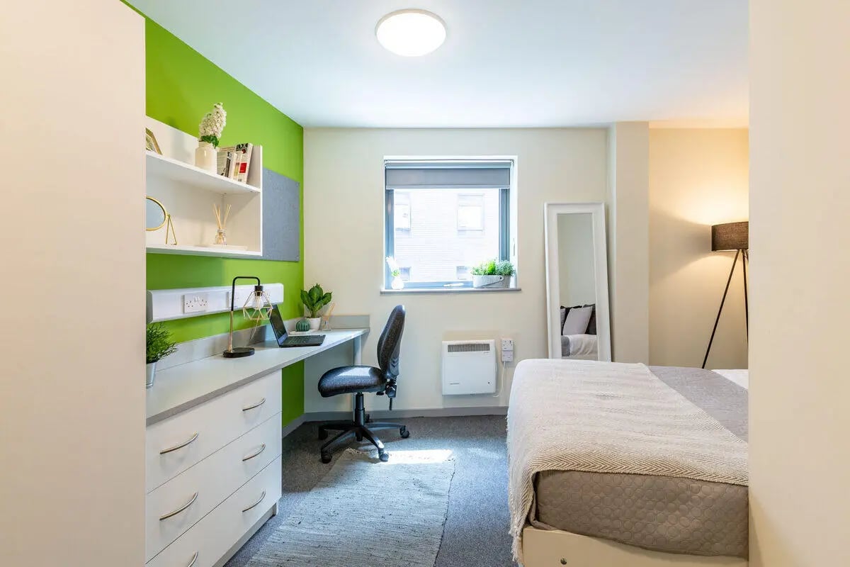 Desk bed mirror lamp floor heating room at Bryson Court in Newcastle Upon Tyne Student Accommodation