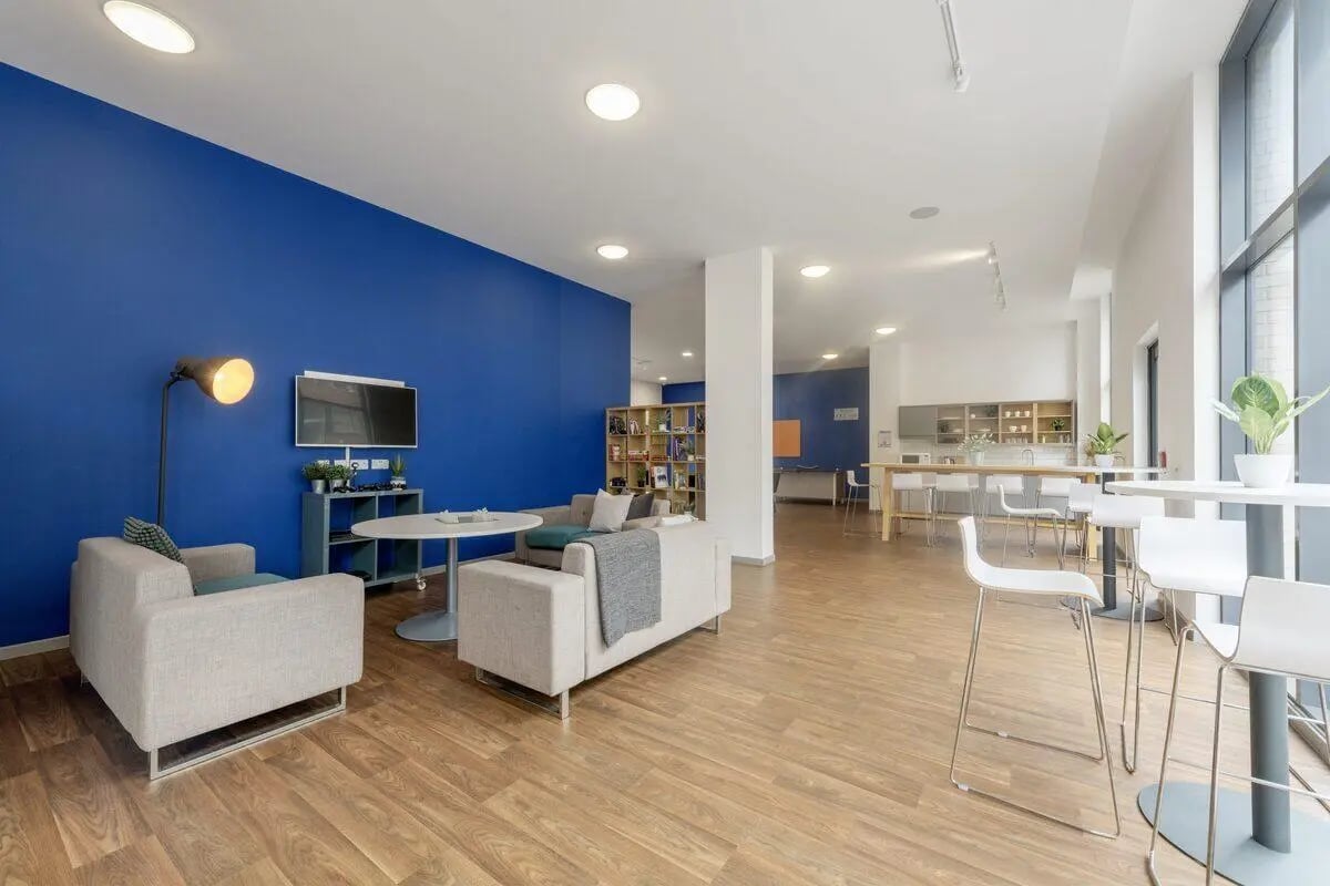 Sofa television tables and kitchen common area at Rosedale Court in Newcastle Upon Tyne Student Accommodation