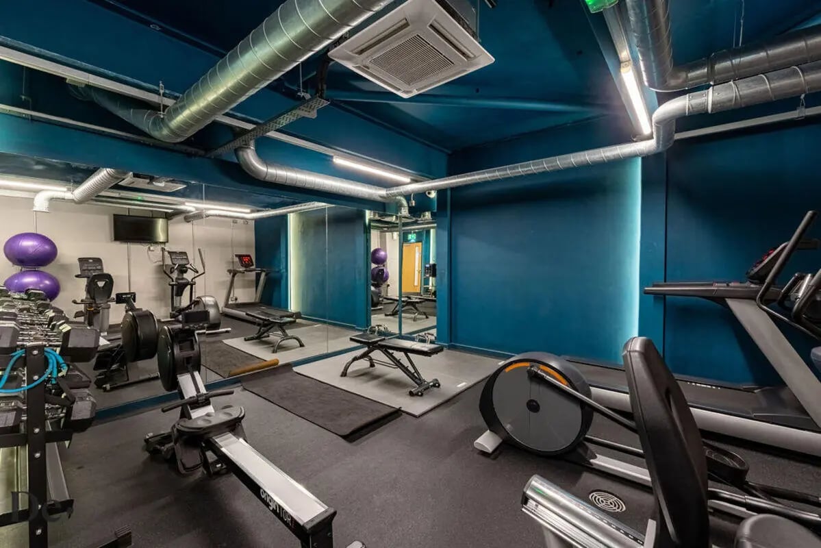 Gym with treadmills rowing machines and weights gym at Castle Hill in Cambridge Student Accommodation