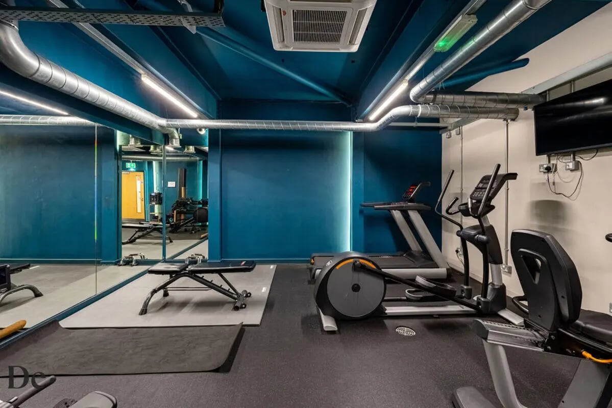 Treadmill elliptical bench mirrors gym equipment gym at Castle Hill in Cambridge Student Accommodation