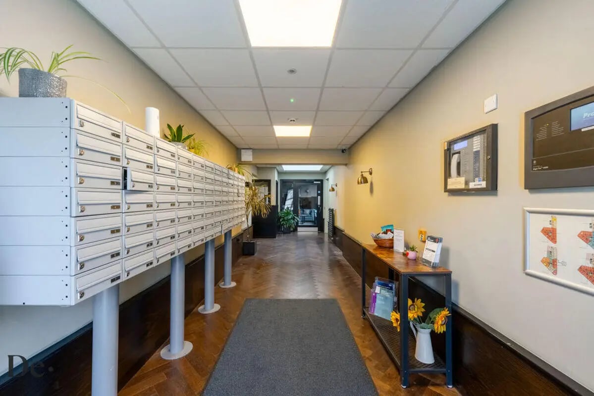 Mailboxes plants and shelf hallway exterior at Castle Hill in Cambridge Student Accommodation