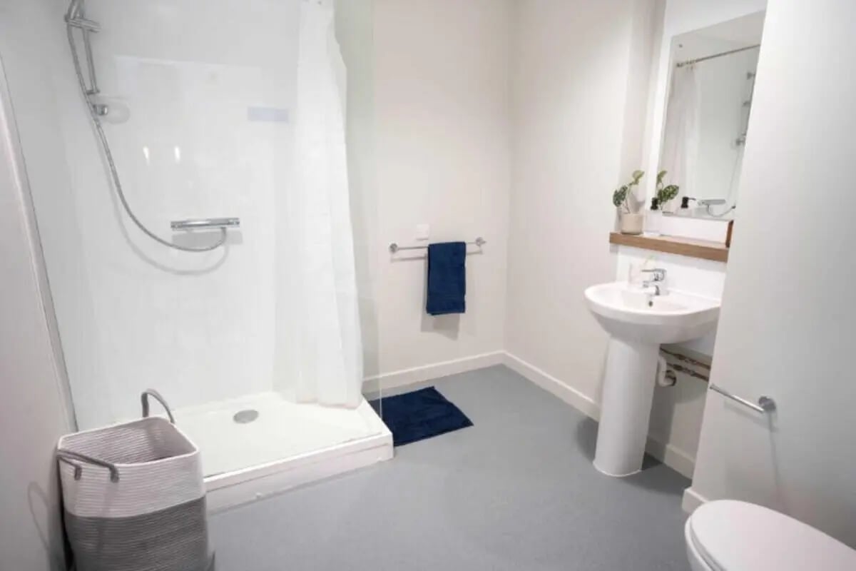 Shower sink and toilet with basket bathroom at The Toybox in Birmingham Student Accommodation
