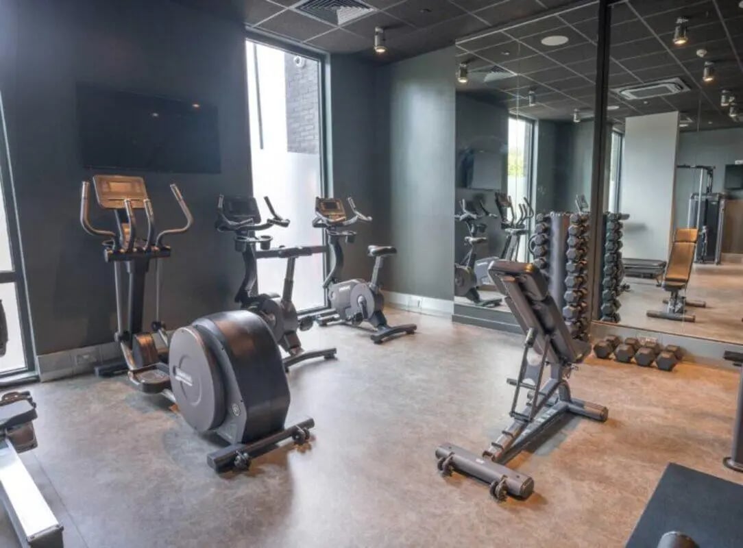 Exercise machines dumbbells and bench Gym at The Toybox in Birmingham Student Accommodation