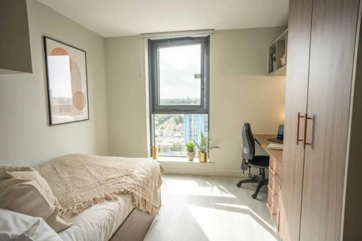 Bed desk plants wardrobe with laptop bedroom at The Toybox in Birmingham Student Accommodation