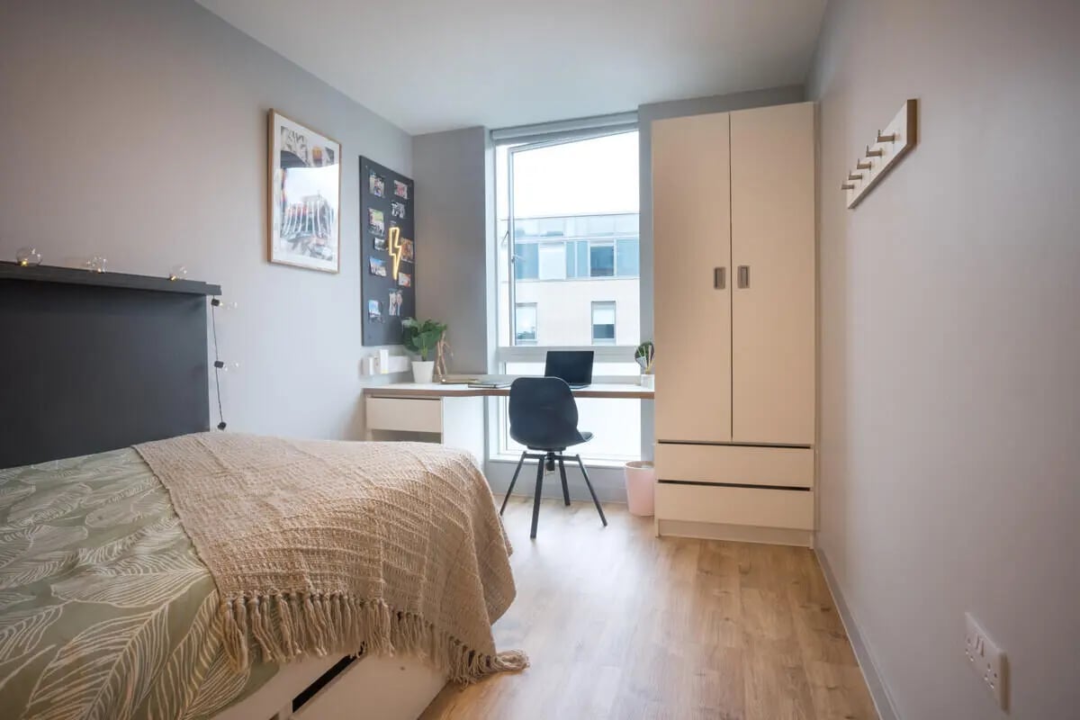 Bed desk closet and chair bedroom at West Wing in Cardiff Student Accommodation