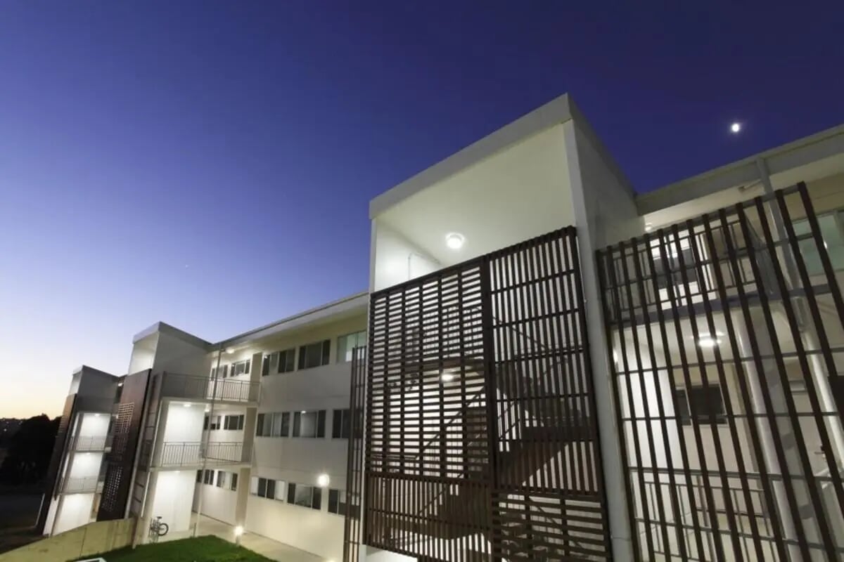 Modern student housing with balconies and wooden screens exterior at Murdoch University Village in Perth Student Accommodation