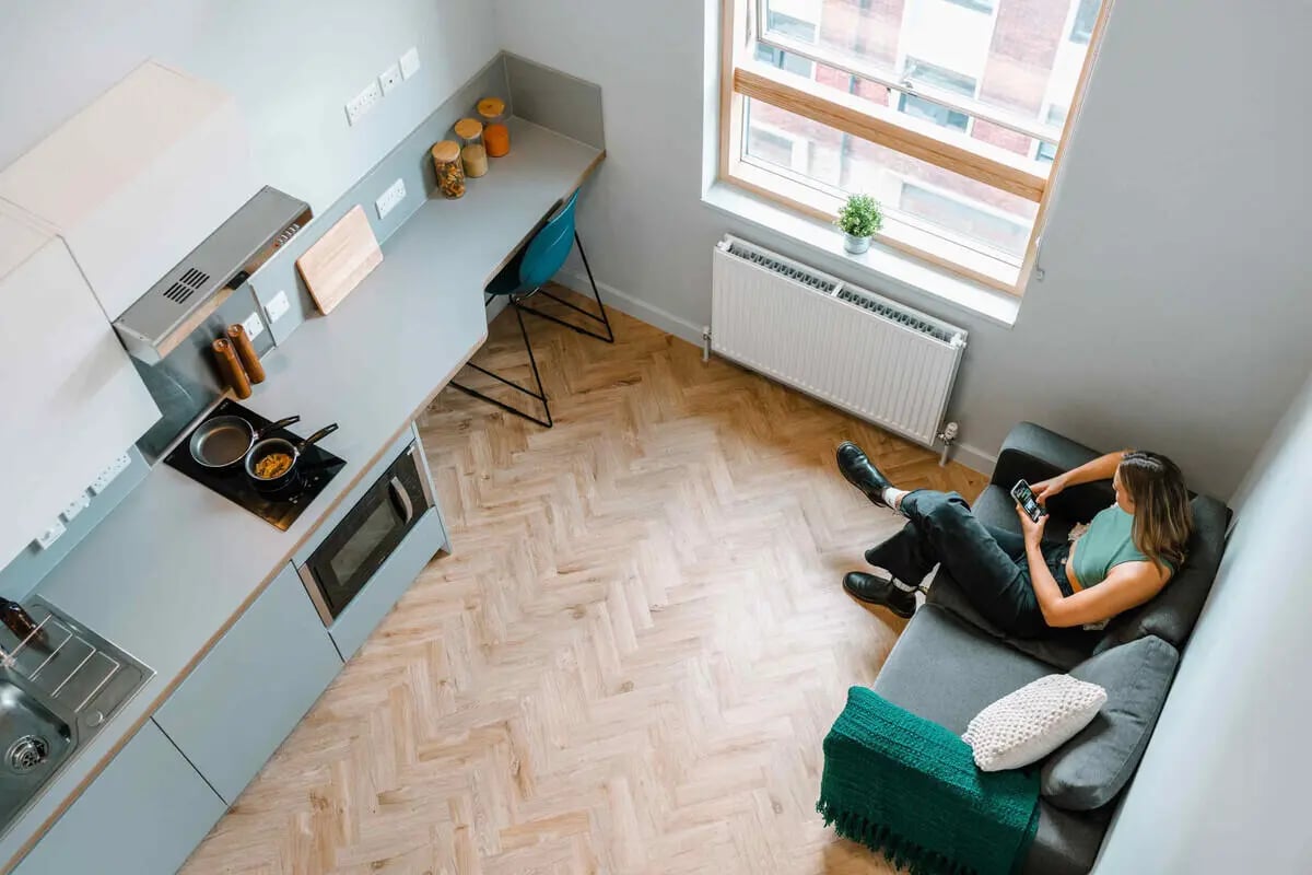 Kitchenette with sofa and person living room at The Depot in Bath Student Accommodation