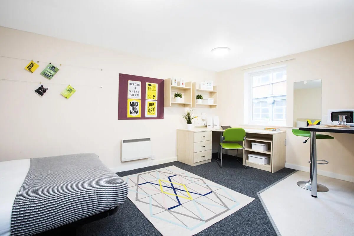 Bed desk chair shelves microwave study area bedroom at The Grange Leicester in Leicester Student Accommodation