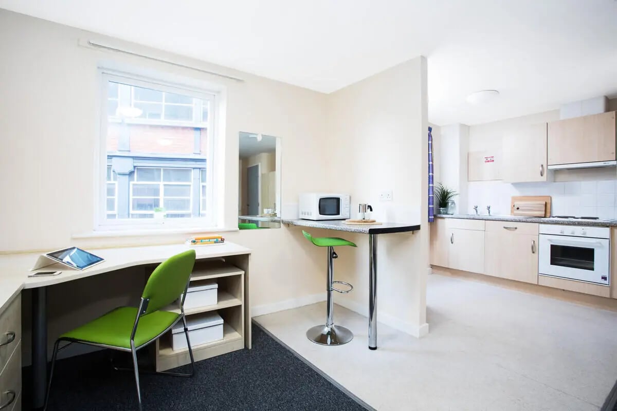 Desk microwave stool kitchen and living area at The Grange Leicester in Leicester Student Accommodation